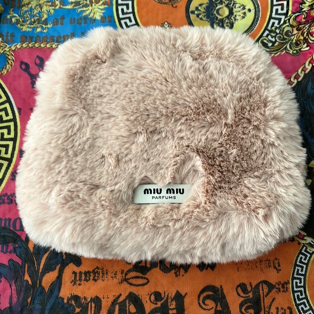 Miu Miu light pink bag. 9 “W by 8”L brand new no tags.
